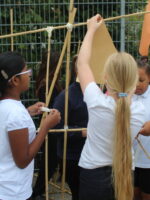 Hanging shapes to a large line made from bamboo canes