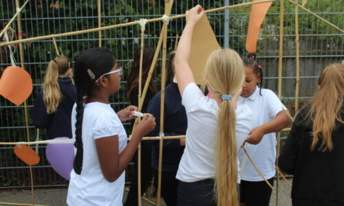 Hanging shapes to a large line made from bamboo canes