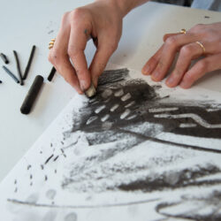 Explore making marks using charcoal to create a composition inspired by coal mines