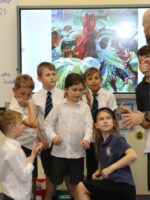 A group of children taking part in a freeze frame activity.
