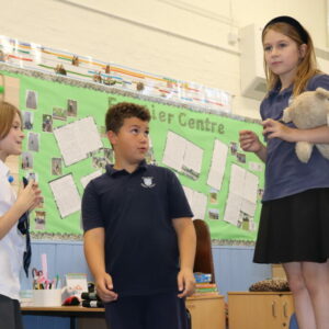 A drama lesson taking place involving role play.