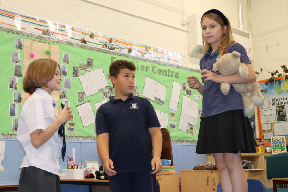 A drama lesson taking place involving role play.