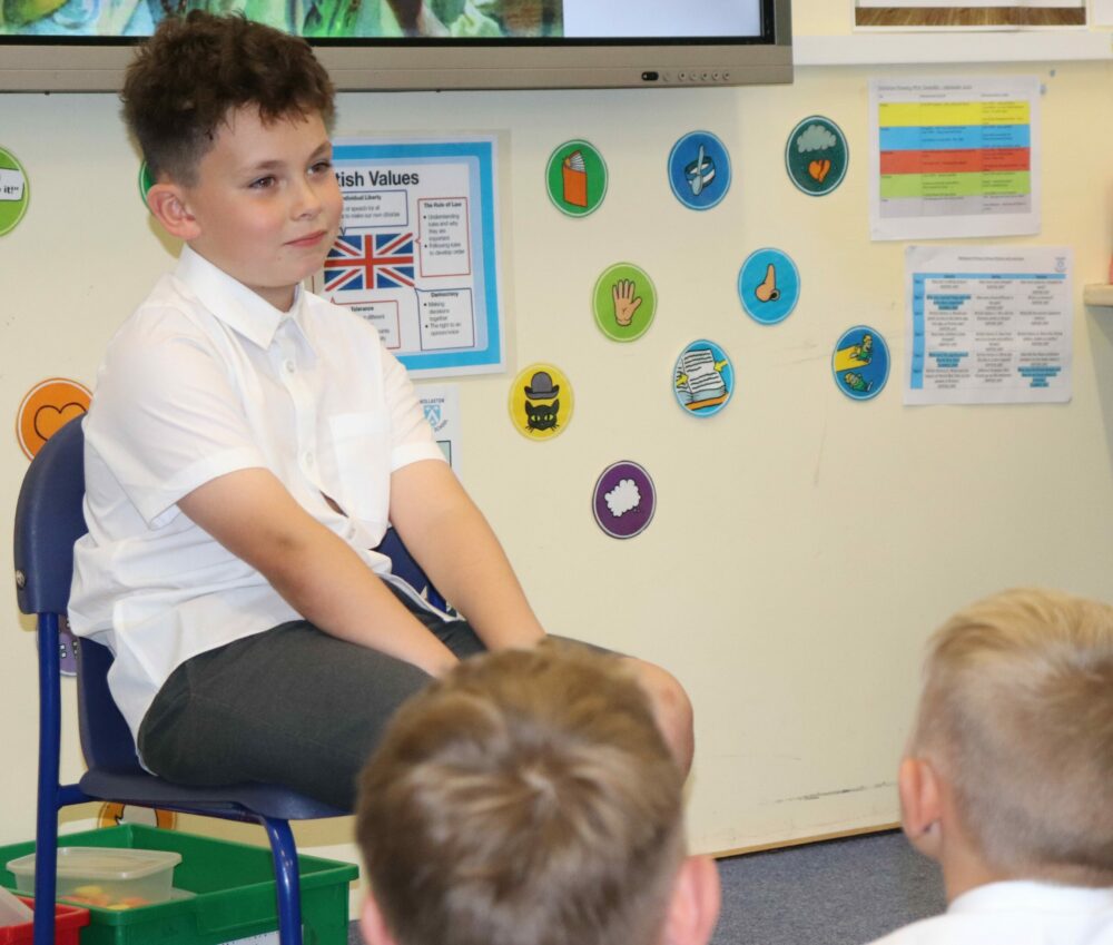 A boy sitting on a chair