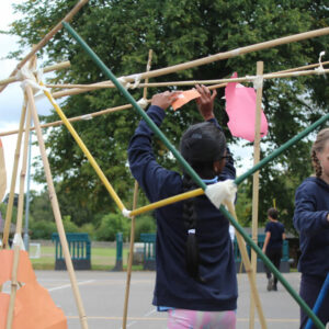 Children Making An Outdoor Installation From Bamboo by Will Downes Children Making An Outdoor Installation From Bamboo by Will Downes