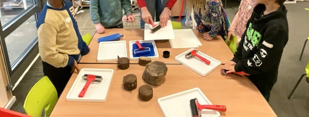 A group of children taking part in an art activity.