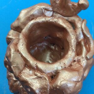 Making clay birds from a mould
