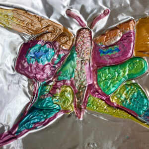An embossed drawing of a butterfly.