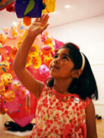 A girl with some paper sculptures