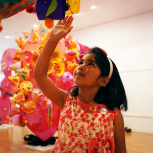 A girl with some paper sculptures
