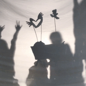 shadow puppets against white sheet