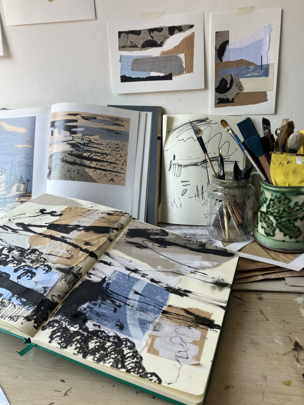 An artist's desk showing a collage collection