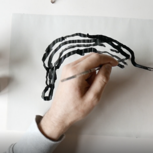 Inky Drawing of a Banana Using Two Hands by Joe Gamble