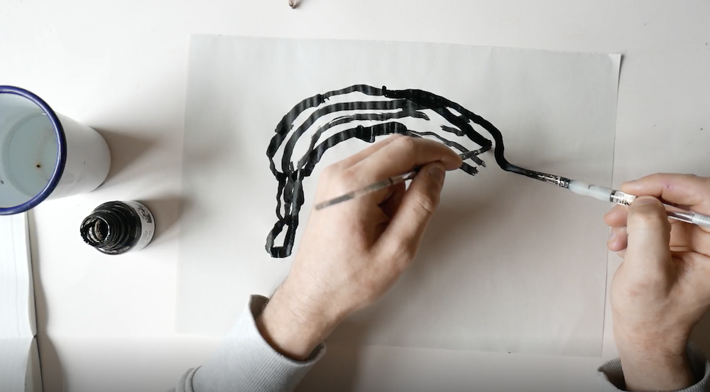 Inky Drawing of a Banana Using Two Hands by Joe Gamble