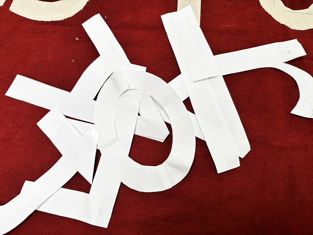 Paper letters ready to be used as templates for fabric letters